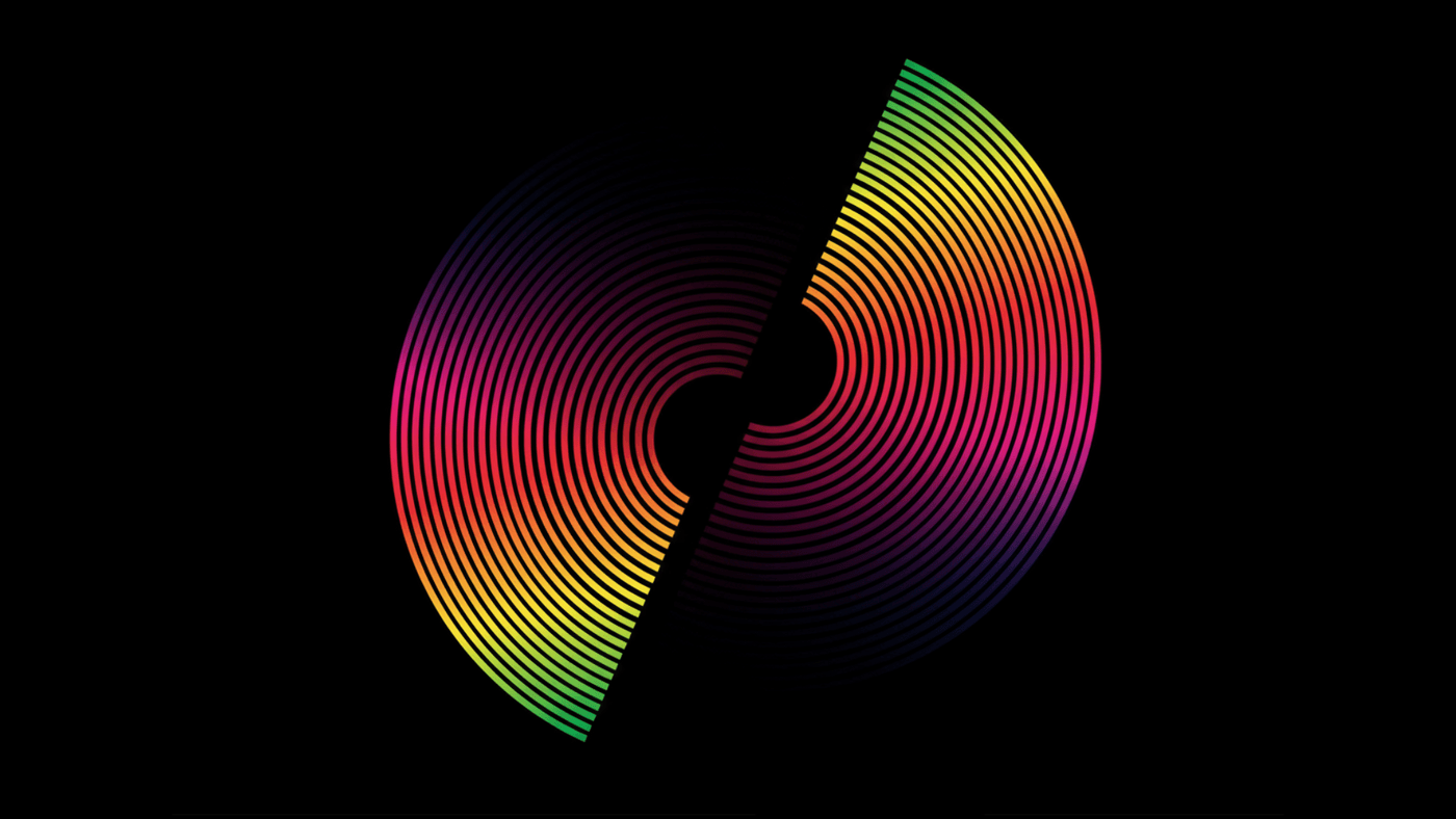 An illustration of a circle which looks like a vinyl record with black grooves, the colours are the colours of the spectrum from green through yellow, orange, red, pink, through to purple and black. The circle is cut in half and separated slightly with the central hole overlapping.
